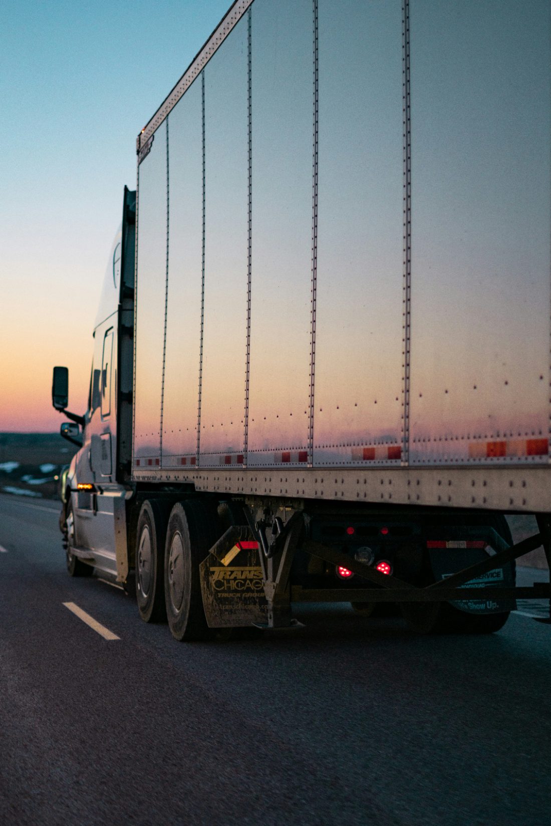 Semi truck on the highway at dusk
